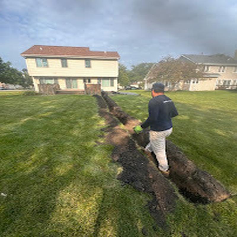 Trenching a mainline across a residential lawn